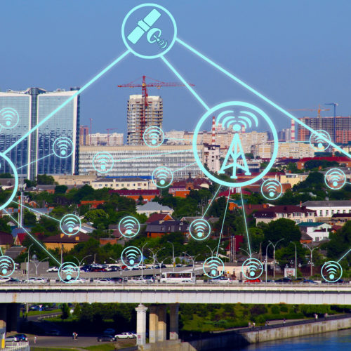 IOT, Internet smart city and network connect Wi-Fi access points. Background and Wi-Fi icons on the background of the city.